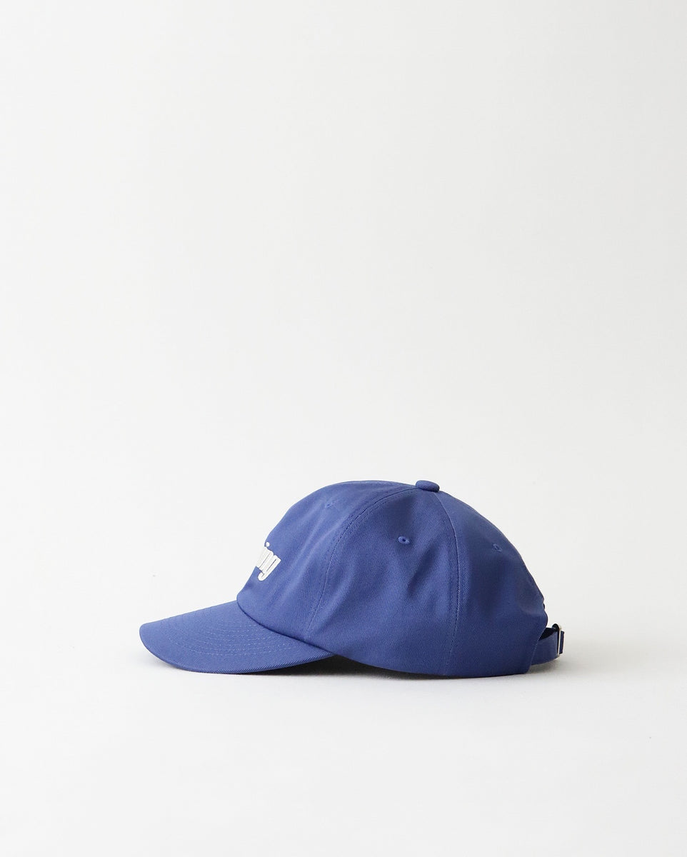 NEPENTHES × Unlikely キャップ　ブルー ネペンテス ロサンゼルス×アンライクリー、逆さ“Nロゴ”の青キャップ