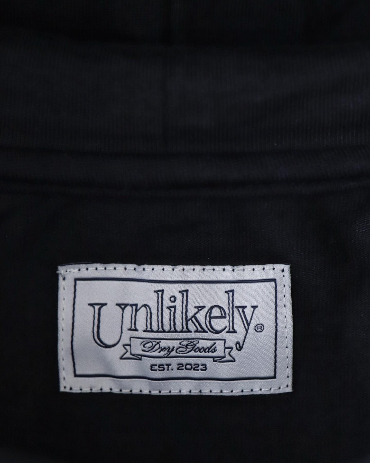 UNLIKELY SPLIT RAGLAN SLEEVE HOODIE