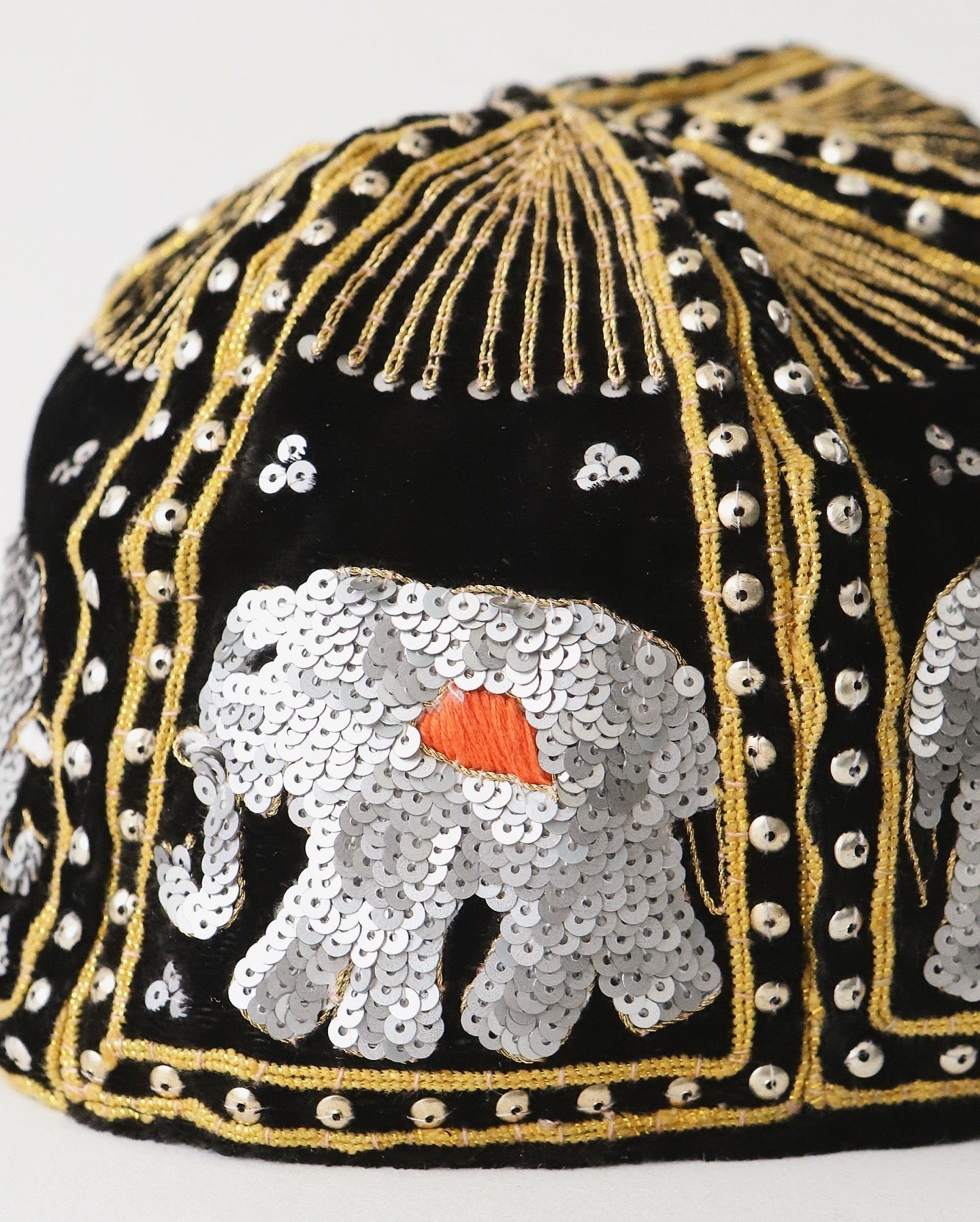 ELEPHANT SEQUIN CAPS BRONZE