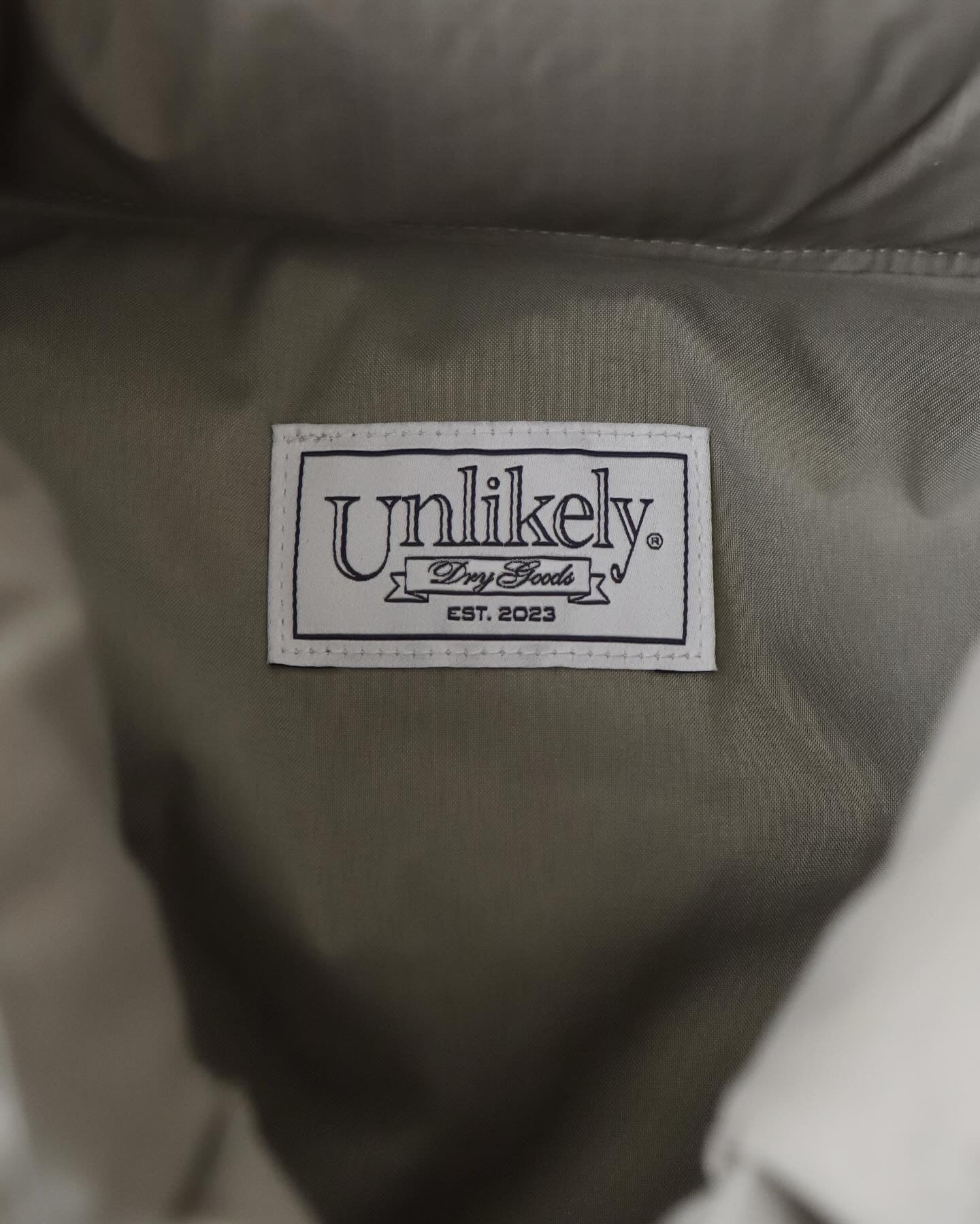 UNLIKELY SIMPLE DOWN VEST