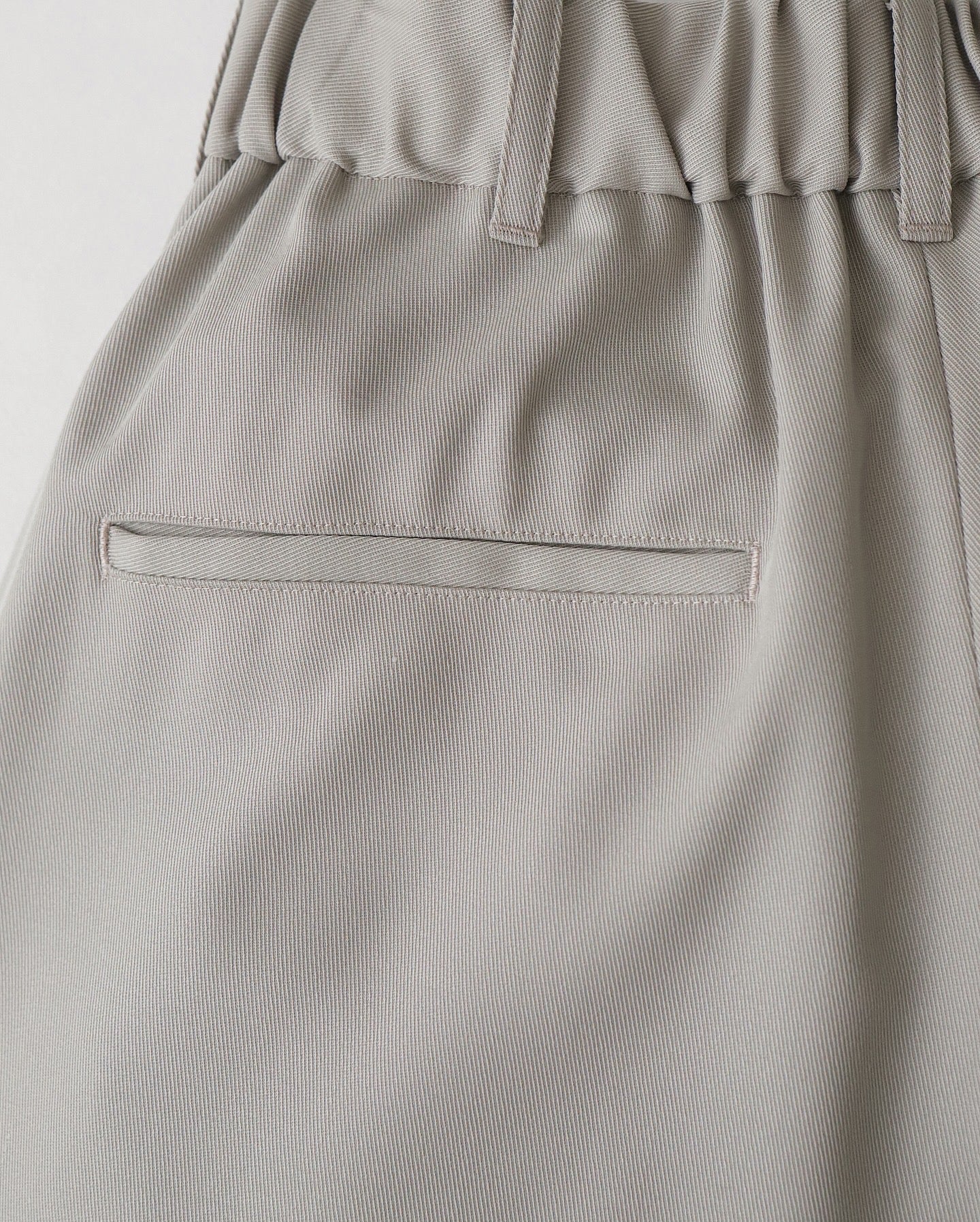 TECHNO WOOL NYLON TWO TUCK WIDE PANTS（WOMEN）