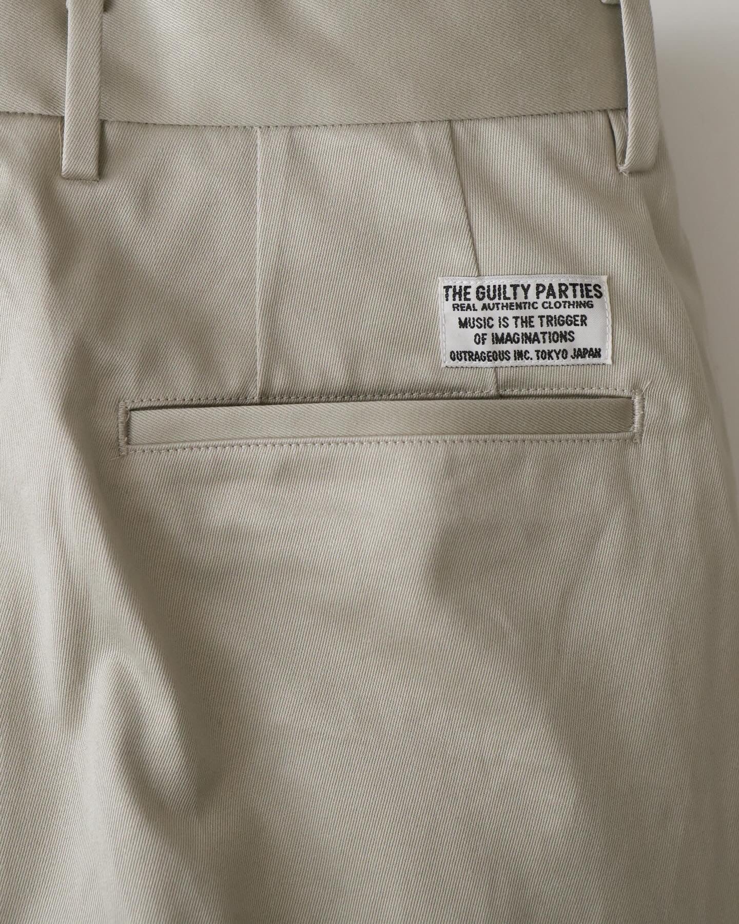 DOUBLE PLEATED CHINO TROUSERS