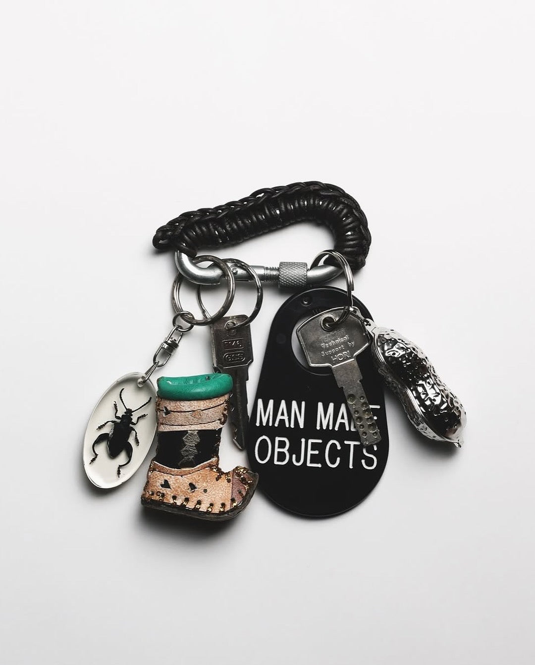 BLACK LEATHER CARABINER BY AURELIE MATHIGOT