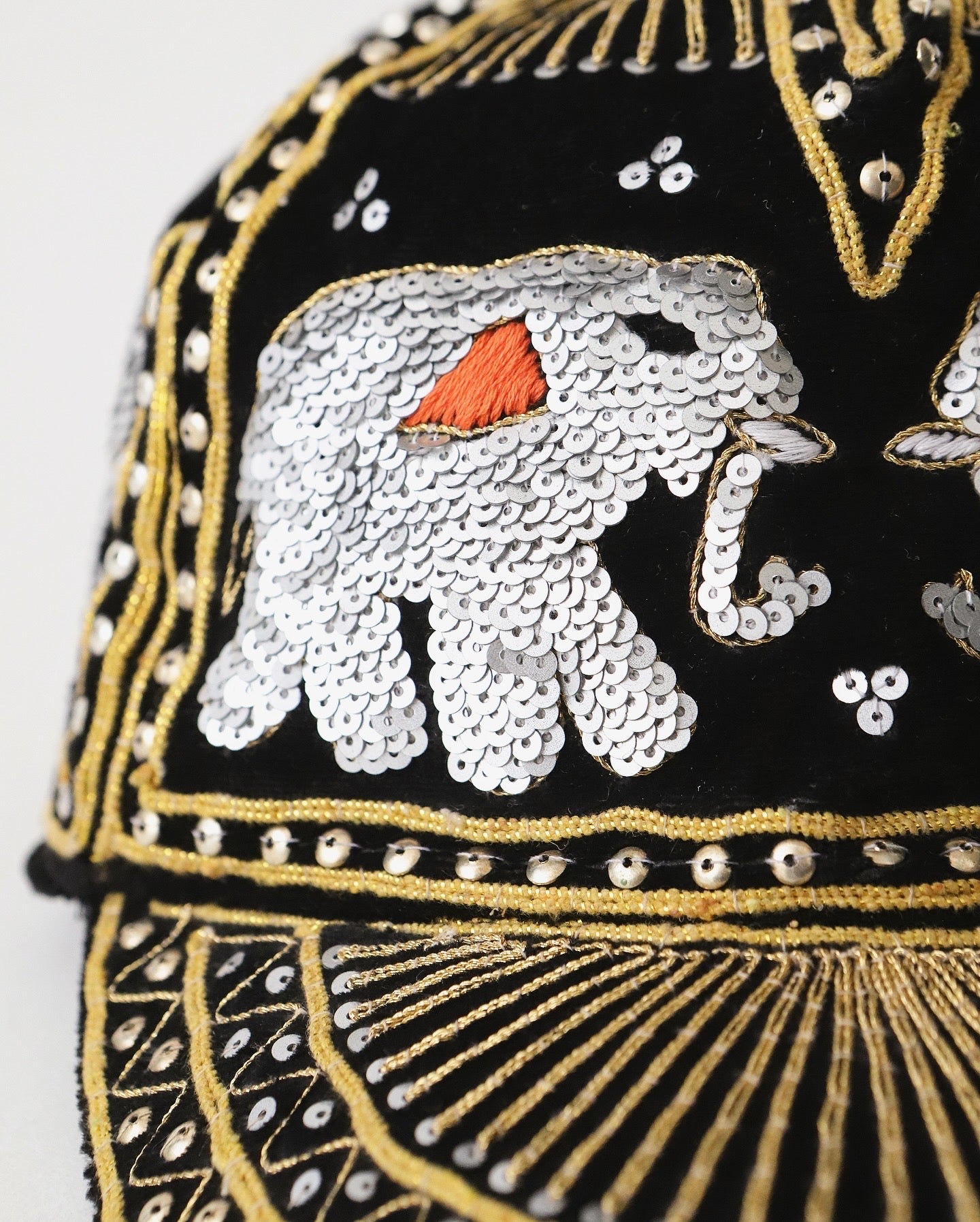 ELEPHANT SEQUIN CAPS BRONZE