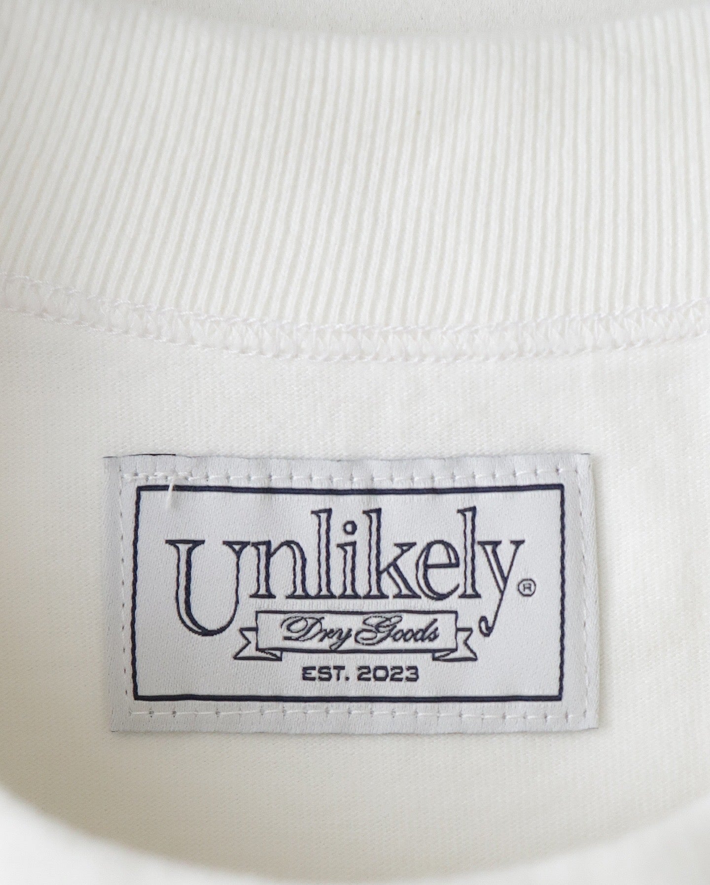 UNLIKELY AUTHENTIC GRAPHIC TEE "WORRY..."
