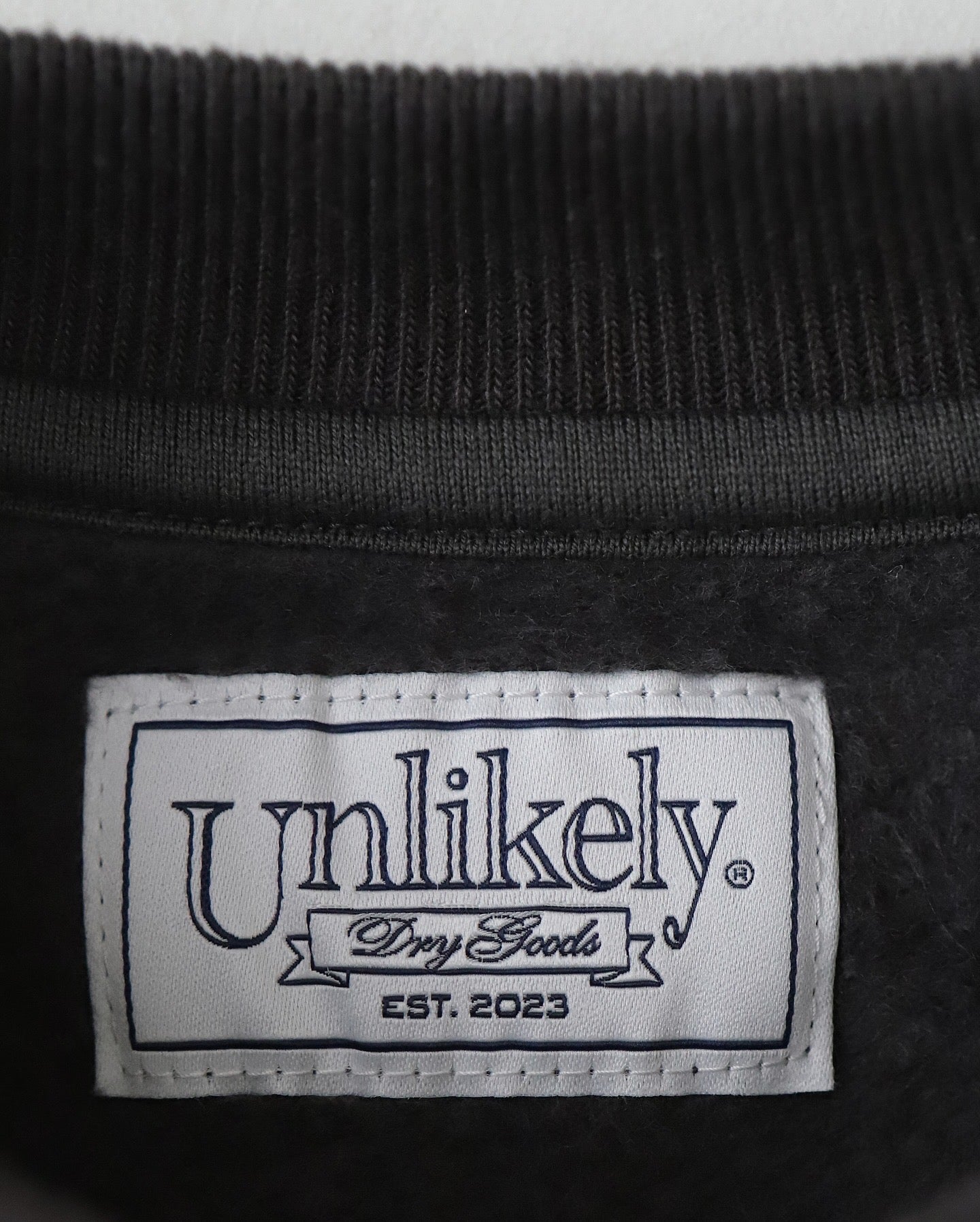 UNLIKELY SIMPLE SWEAT CREW "RESERVE"