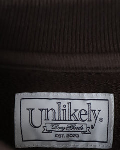 UNLIKELY SPLIT RAGLAN SLEEVE CREW