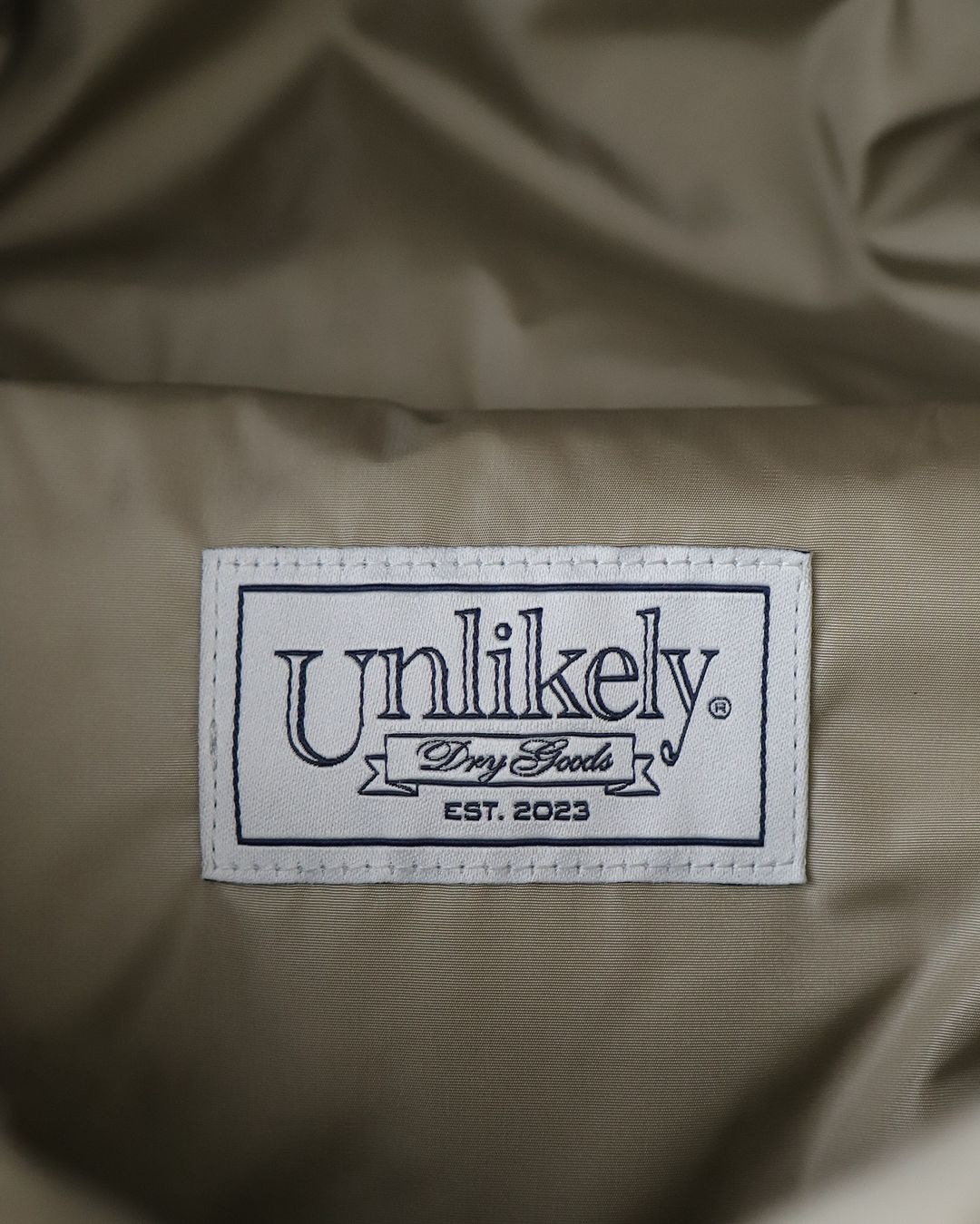 UNLIKELY ALPINE DOWN PARKA