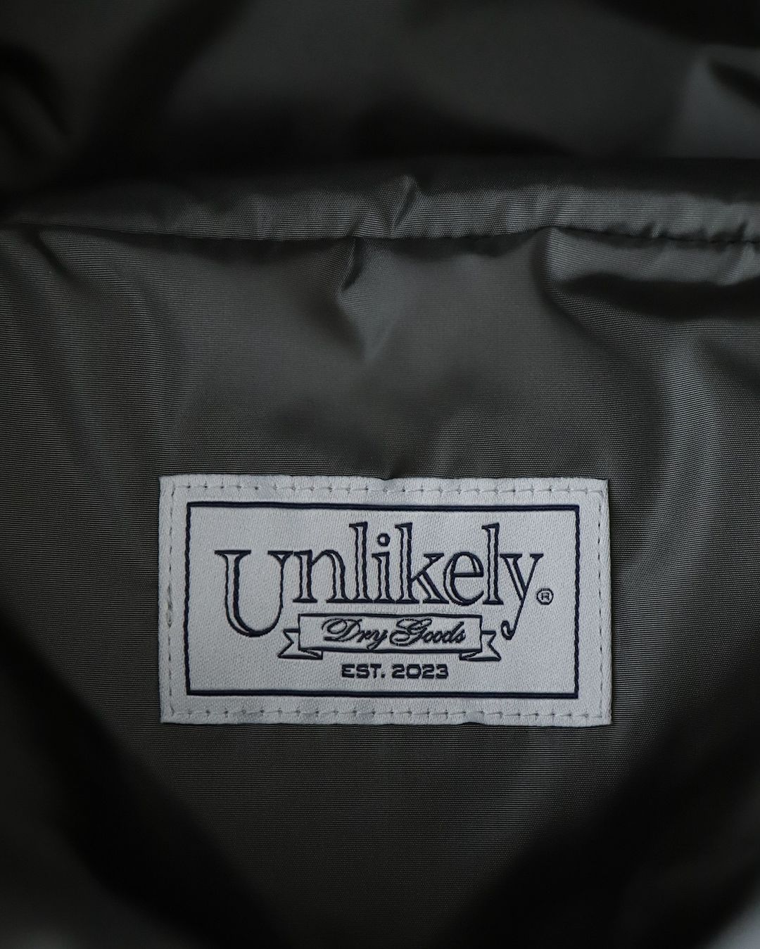 UNLIKELY ALPINE DOWN PARKA