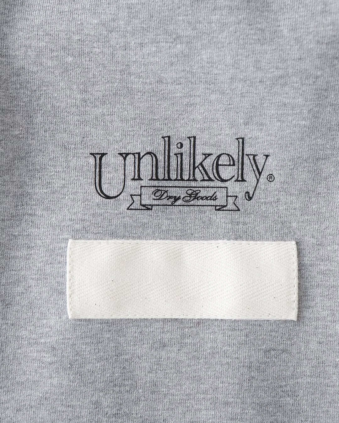 UNLIKELY TEAM TEE