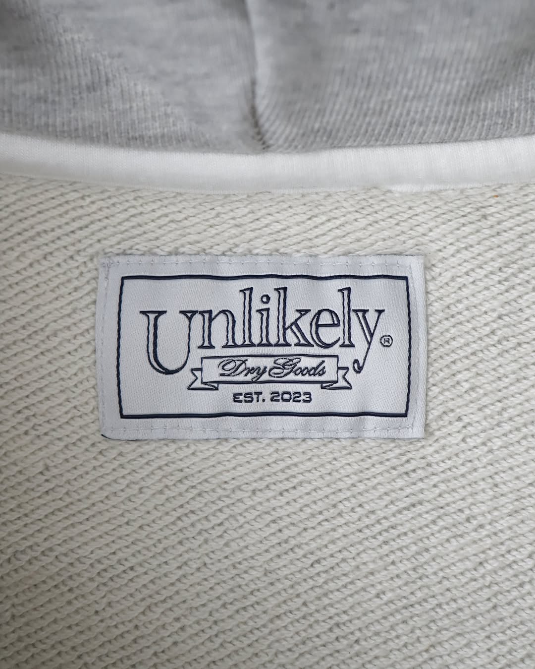 UNLIKELY SIMPLE SWEAT ZIP UP HOODIE